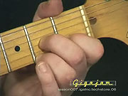 Playing the chord of D7.