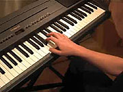 Playing the A with the thumb of the right hand.