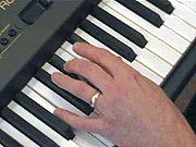 Playing the chord of B.