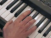 Playing the chord of B.