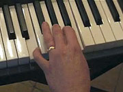 Playing the chord of E.