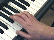Playing the chord of E.