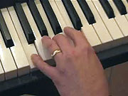 Playing the chord of F.